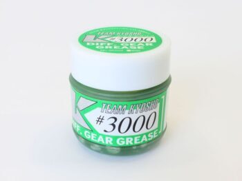 Op de foto is een klein, rond potje te zien met een witte dop en een groen etiket. Het etiket vermeldt 'TEAM KYOSHO #3000 DIFF. GEAR GREASE'.