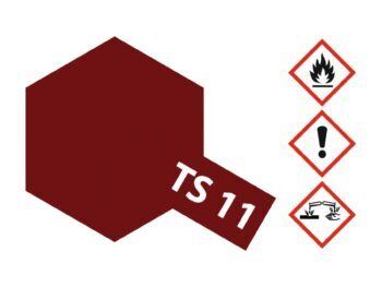 De afbeelding toont een donkerrood, zeshoekig vlak met de tekst 'TS 11' in wit. Rechts staan drie waarschuwingssymbolen: een vlam, een uitroepteken en een symbool voor corrosie.