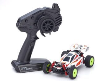 The image shows a white radio-controlled buggy with orange and red accents, along with a black remote control. The buggy has neon yellow rims and red shock absorbers.