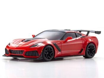 The photo shows a red Chevrolet Corvette ZR1 model car. The model has a black roof, black alloy wheels and a large black rear spoiler.