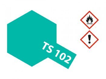 Een zeshoekige vorm in de kleur kobaltgroen, met de tekst 'TS 102' erop. Rechtsboven staan twee gevarensymbolen.