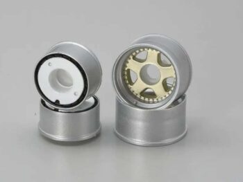 The photograph shows four rims, two stacked on top of each other. The rims have a silver-coloured exterior and a gold interior.
