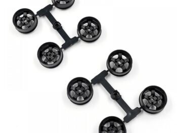 La photo montre des jantes noires fixées à un cadre. Ces jantes ont un design à rayons et sont en plastique.