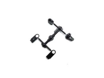 The photograph shows a set of black plastic parts, presumably for a model car. The parts have different shapes and are connected to each other.