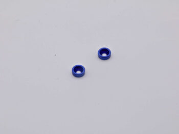 De foto toont twee blauwe ringvormige onderdelen. Ze lijken van metaal te zijn gemaakt.