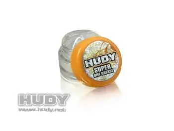 De foto toont een klein, doorzichtig potje met een oranje deksel. Op de deksel staat de merknaam 'Hudy' en de productnaam 'Super Diff Grease'.