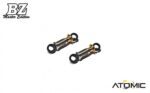 twee rc auto schokdempers met gouden accenten