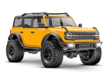 Traxxas TRX97074-1ORNG Traxxas TRX-4M 1/18 Scale and Trail Crawler Ford Bronco 4WD Electric Truck with TQ Orange - een gele op afstand bestuurb
